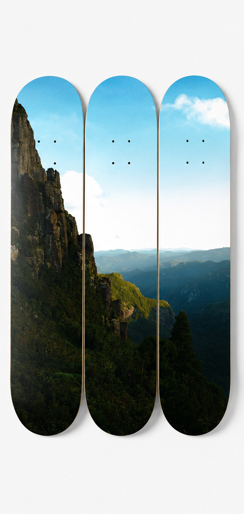 Set of skateboard decks with mountain landscape design on a white background,